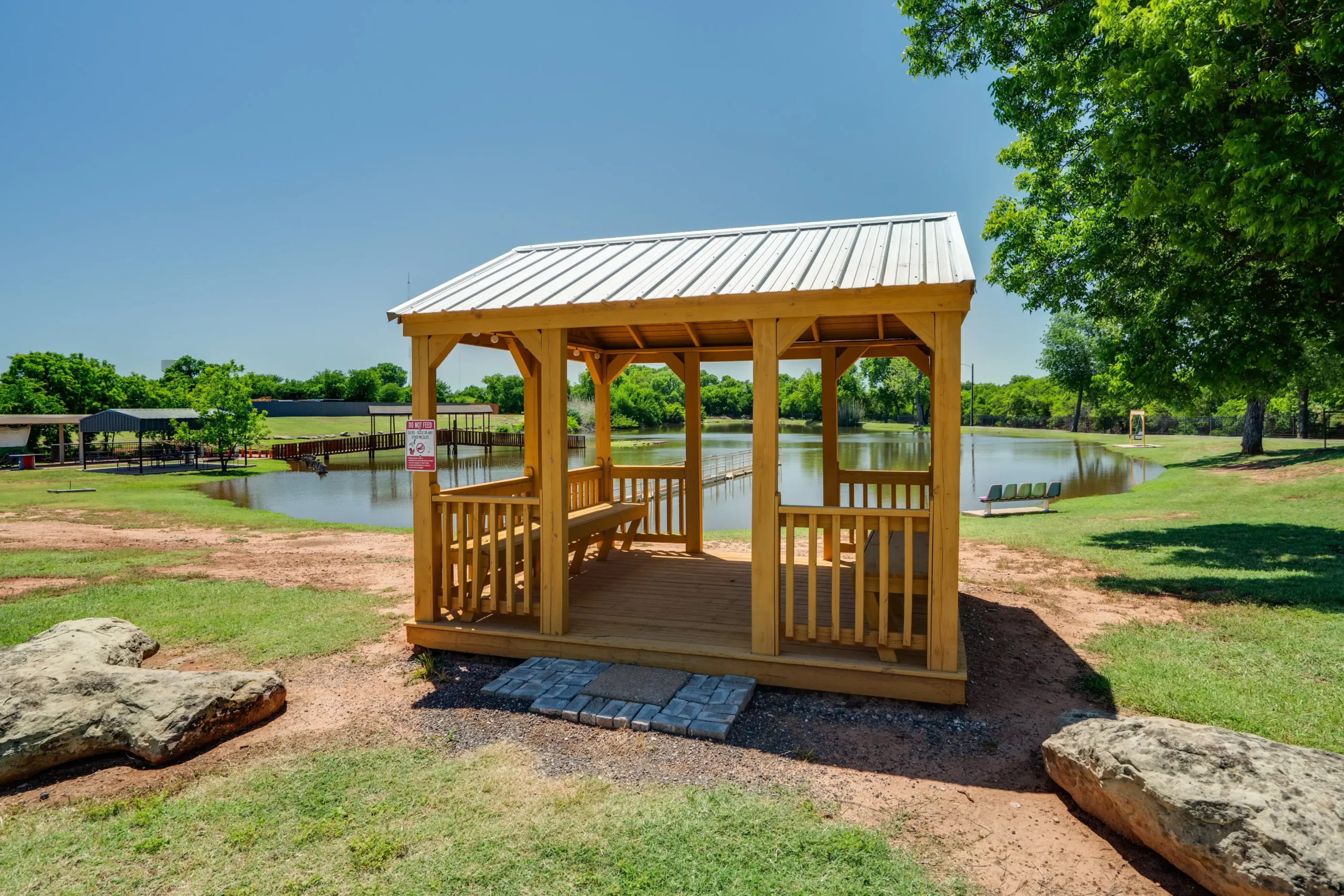 Gazebor & Fishing Pond at Wichita Falls RV Park Lakeside gazebo at Wichita Falls RV Park offers peaceful waterfront views, shaded relaxation, fishing access, and scenic outdoor gathering space year-round.
